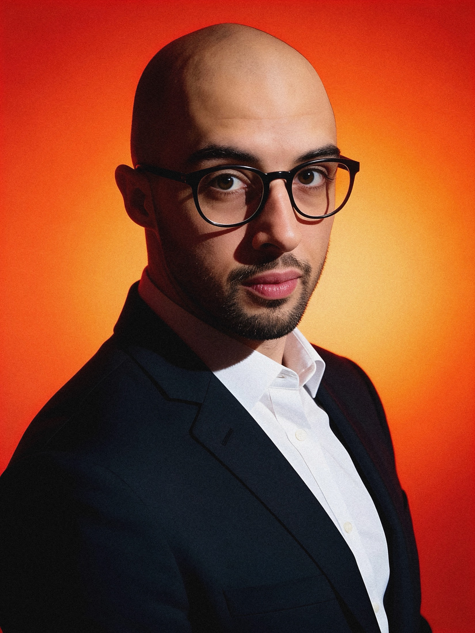 Tonebreak portrait against an orange backdrop
